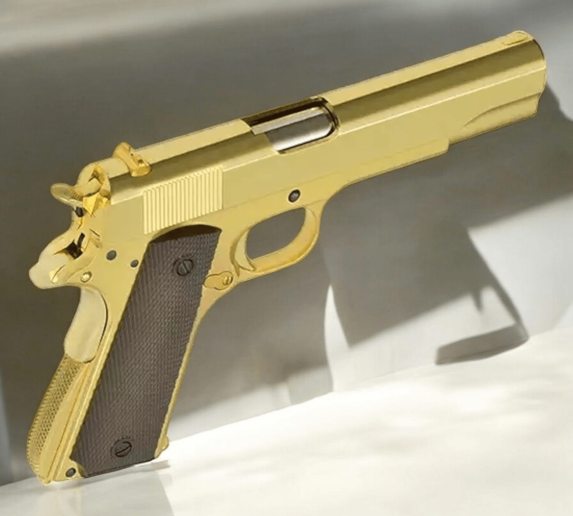 Golden Eagle 3305G Classic 1911 gold gas pistol on display, showcasing polished gold finish and authentic design.