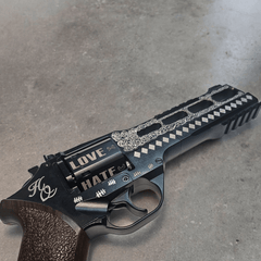 Custom Harley Quinn Chiappa Rhino revolver with laser etching, featuring 'LOVE' and 'HATE' inscriptions.