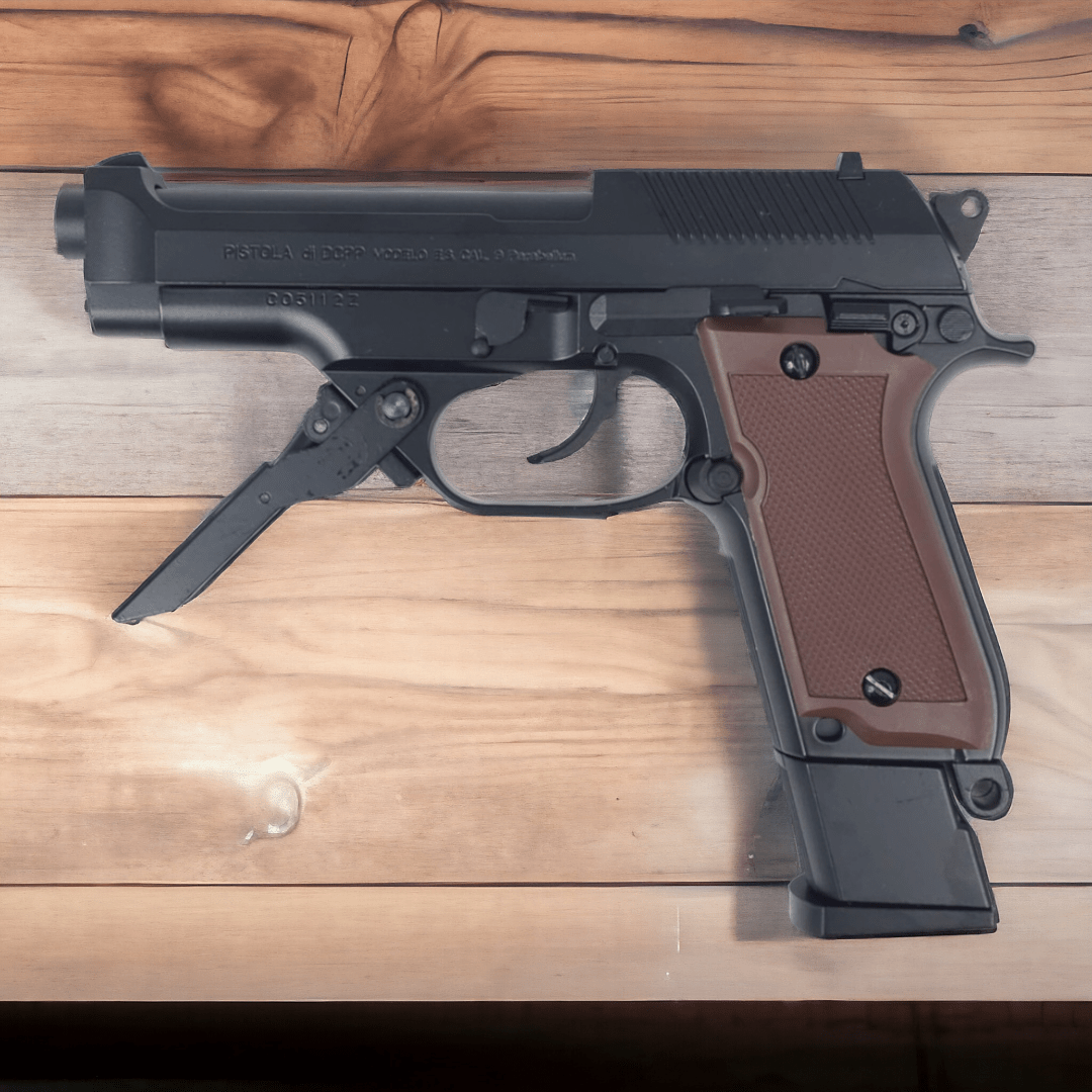 Black KELe Beretta 93R Manual Springer Gel Blaster Pistol on wooden surface, showcasing detailed design.