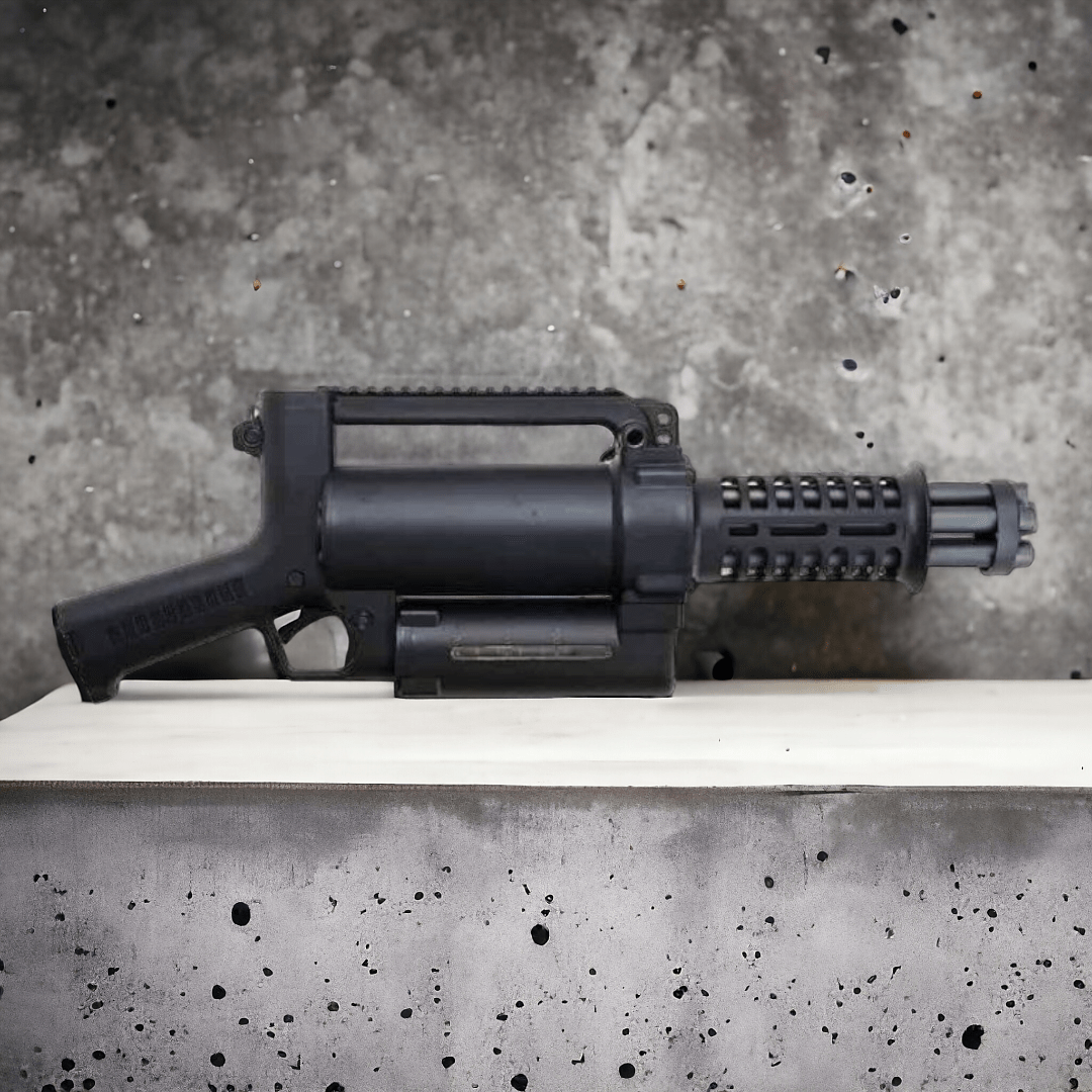 M134 Mini Vulcan Gel Blaster AEG with rotating barrels and ergonomic design on a concrete surface.